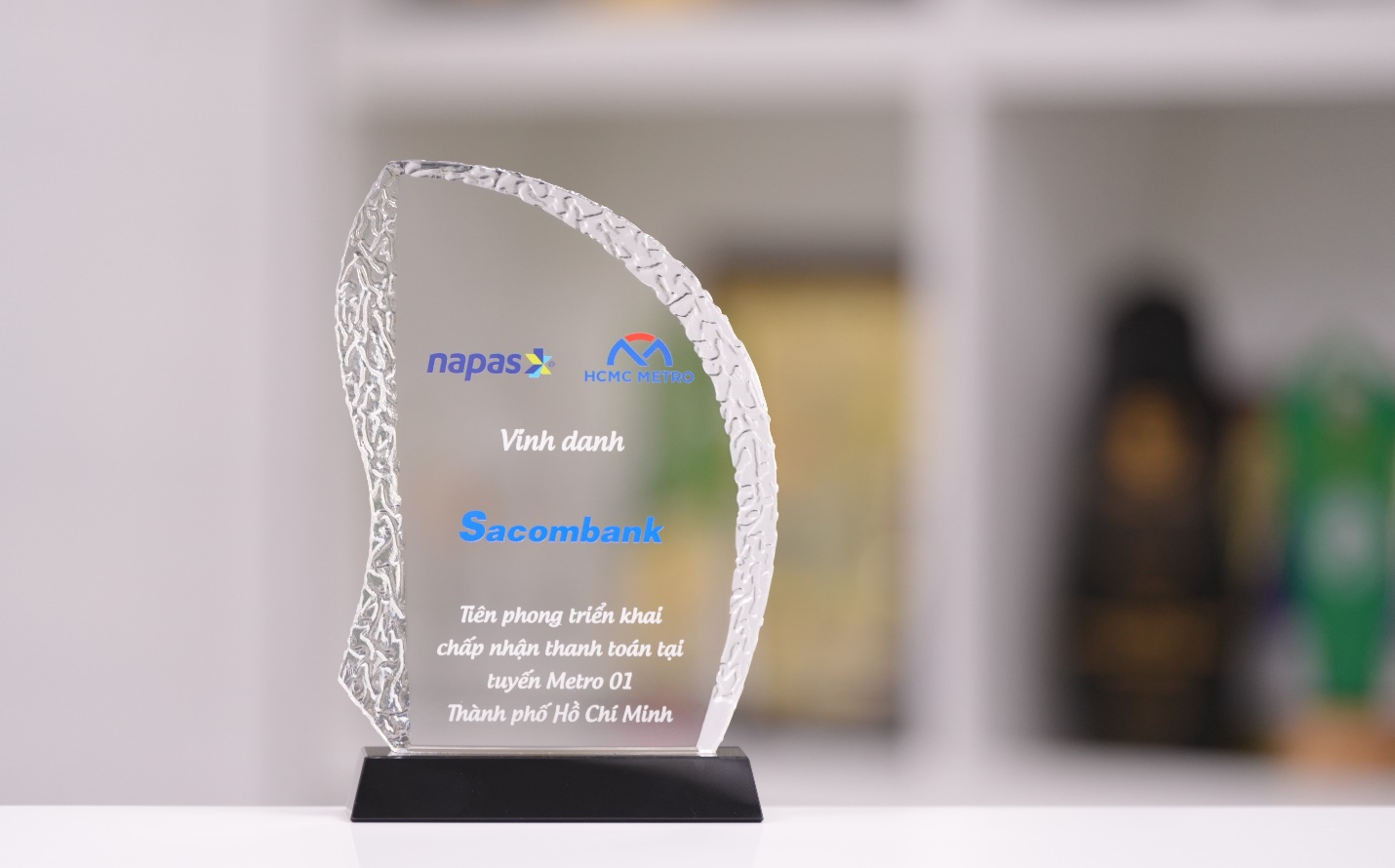 A close-up of a glass trophy Description automatically generated