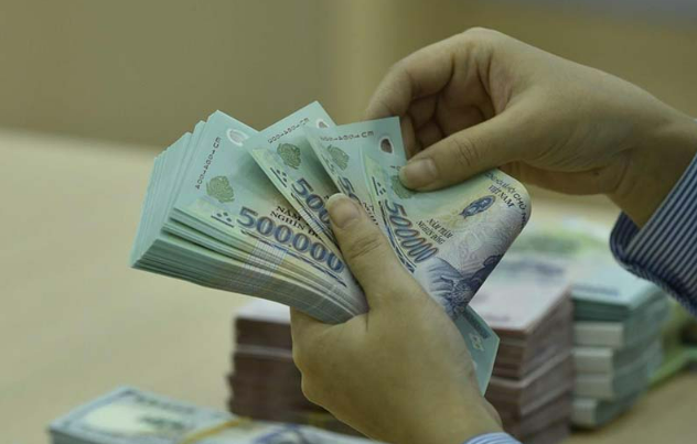 Từ 15/9, các ngân hàng phải duy trì tỷ lệ an toàn vốn tối thiểu 8% - Ảnh 1.