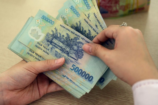 Chuyển tiền từ 500 triệu đồng trở lên sẽ phải báo cáo- Ảnh 1.