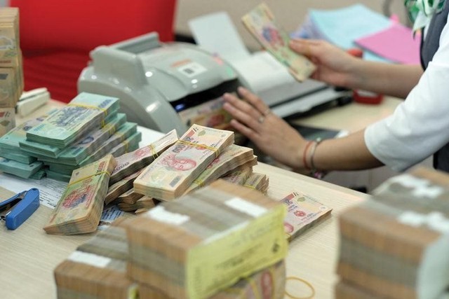 Ngân hàng lớn nhất Việt Nam thu ròng 200 tỷ/ngày, lợi nhuận lần đầu cán mốc lịch sử - Ảnh 1. Ngân hàng lớn nhất Việt Nam thu ròng 200 tỷ/ngày, lợi nhuận lần đầu cán mốc lịch sử - Ảnh 1.